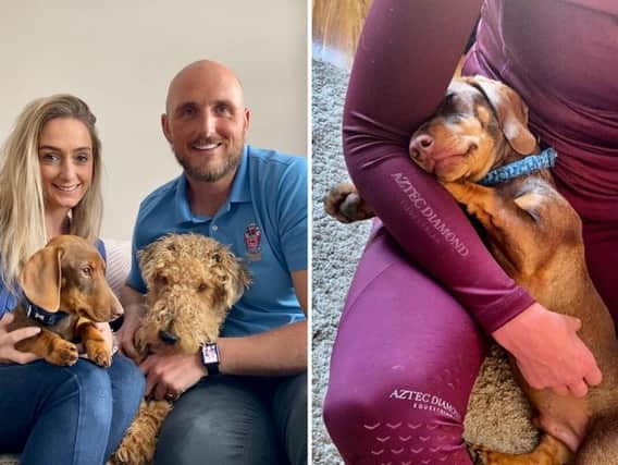 Fern Holmes with seven-month old sausage dog Floyd, who spent three days lost on farmland and was reunited with his emotional owners after they tried to entice him from his hiding place by cooking bacon.