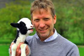 Pictured, one of the Yorkshire Vets Julian Norton with a newborn lamb at Cannon Hall Farm near Barnsley where Springtime on the Farm is being filmed, by Leeds-based Daisybeck Studios, for Channel Five. Photo credit: Gary Longbottom/ 	JPIMedia Resell