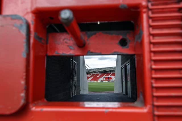 A veiw through a locked gate at the AESSEAL New York Stadium home of Rotherham United.
