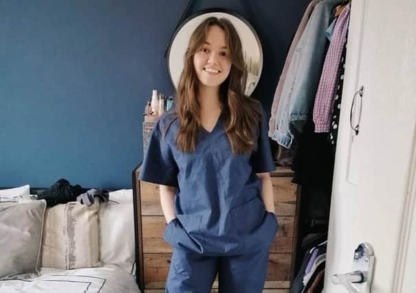 Laura Sedman of Laurelle Woman tries out her scrubs.