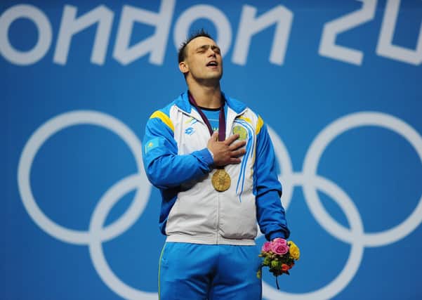Changing of the guard: Controversial weightlifter Ilya Ilyin celebrates Olympic gold in 2012. (Picture: Getty Images)