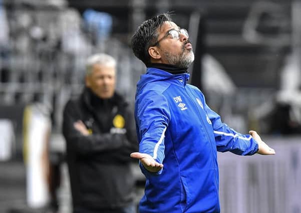 Oh no: Schalke head coach and former Huddersfield Town chief David Wagner reacts as his side fall to Borussia Dortmund. Picture: AP