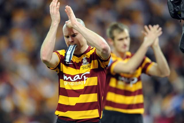 Bantams captain Gary Jones with James Hanson disappointed at the end of a 5-0 defeat in League Cup final.