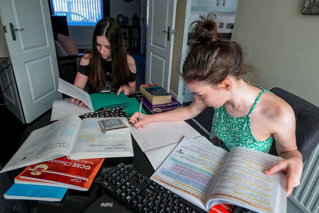 Lulu Byrne aged 13 and Maisy Byrne aged 15 take part in home schooling, studying mathmatics, english and sciences from their home in Liverpool. Picture:  Peter Byrne/PA Wire