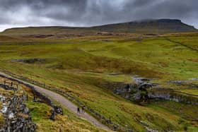 Walkers on the Three Peaks Challenge route in the Yorkshire Dales