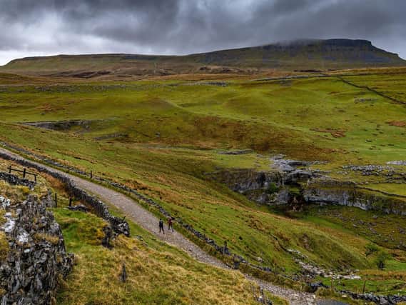 Walkers on the Three Peaks Challenge route in the Yorkshire Dales