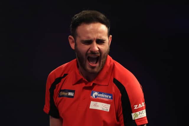 Joe Cullen celebrates during his match against Corey Cadby during day five of the William Hill World Darts Championship at Alexandra Palace, London. PRESS ASSOCIATION Photo. Picture date: Monday December 19, 2016. See PA story DARTS World. Photo credit should read: John Walton/PA Wire. RESTRICTIONS: Use subject to restrictions. Editorial use only. No commercial use. Call +44 (0)1158 447447 for further information.
