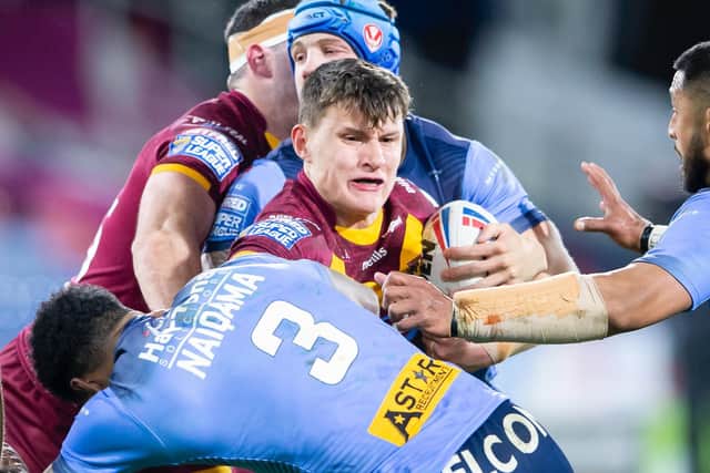 Huddersfield Giants'Innes Senior is tackled by St Helens' Theo Fages and Kevin Naiqama last year. (Allan McKenzie/SWpix.com)