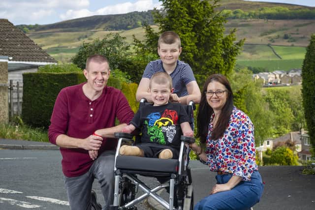 Adam and Christine Mortimer with their boys Harry, 11, and seven year old Luke who lost his arms and legs to meningitis in December and has just been allowed home to Skipton.  The local community and rugby club have rallied round and raised £130,000.  Picture Tony Johnson