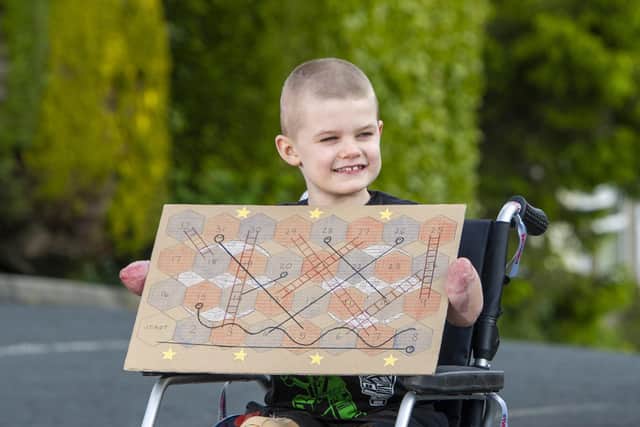 Luke was taught at Sheffield Children's Hospital school and devised his own boardgame. Picture Tony Johnson