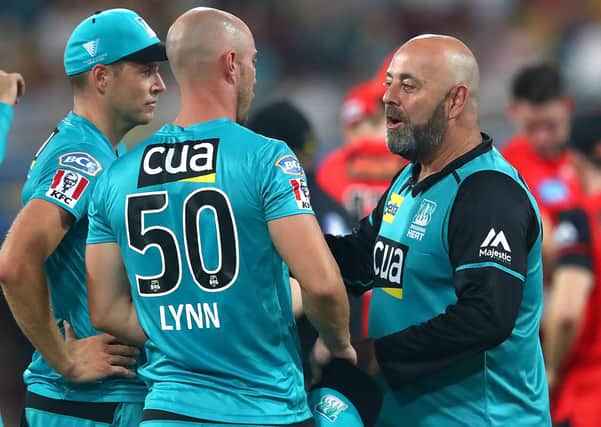 On way back: Heat coach Darren Lehmann, right, talking to captain Chris Lynn during a time out during the Bash Bash League match between Brisbane Heat and Melbourne Renegades at The Gabba, returning to Headingley next summer. Picture: Jono Searle/Getty Images