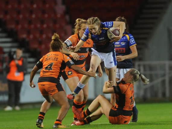 Leeds Rhinos' Caitlin Beevers takes on the Castleford Tigers defence in last year's Grand Final. Picture by Steve Riding.