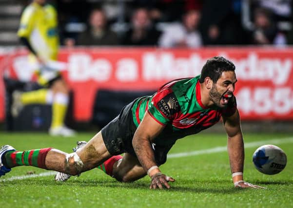 Picture by Alex Whitehead/SWpix.com - 22/02/2015 - Rugby League - World Club Challenge - St Helens v South Sydney Rabbitohs - Langtree Park , St Helens, England - Rabbitohs' Greg Inglis celebrates his try.