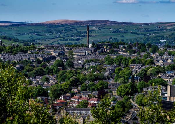 A view over Halifax, West Yorkshire, from top of Southowram Bank, Beacon Hill, Halifax. Pictured Wainhouse Tower. Photo: James Hardisty
