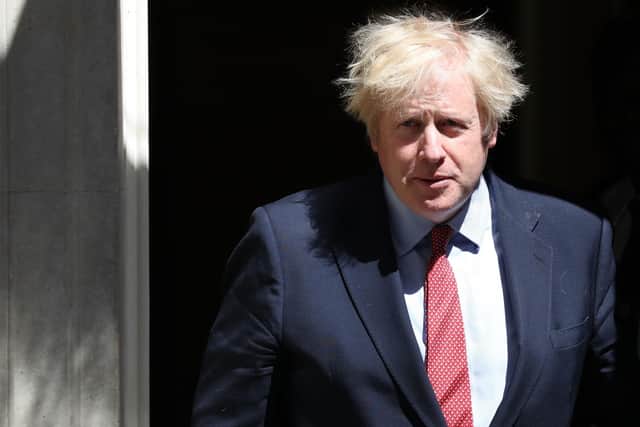 Boris Johnson leaves 10 Downing Street for PMQs.