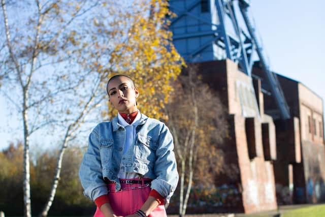 Model Naz stands in front of Barnsley Main Colliery in Kirkby Cargo Pants in Strawberry from Lucy & Yak’s Made in Britain Collection, £65. The colliery was selected to reflect the industrial history of Barnsley where the garments are made. Photograph by Jessica Withey.