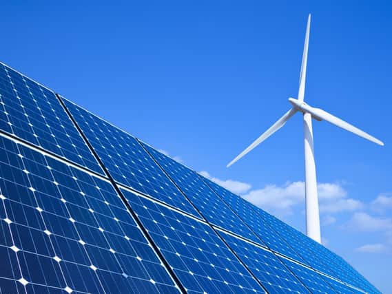 Pictured, solar panels and wind turbine. The University of Sheffield has signed new electricity contracts, making its purchased supply 100 percent renewable for the first time. Photo credit: other