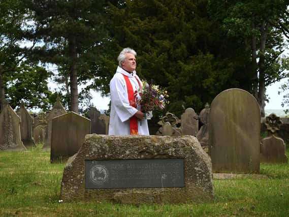 Rev Craig Marshall pictured at Weeton's St Barnabas church, where there is a memorial stone. Picture Jonathan Gawthorpe