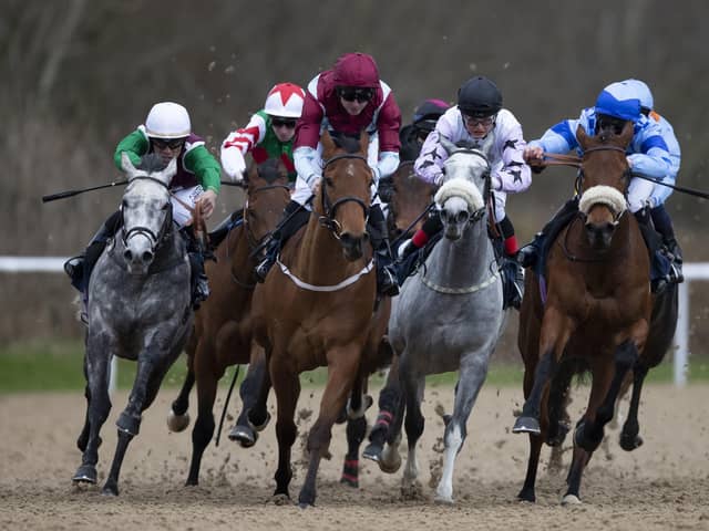 On way back: Jockeys will be required to wear masks on the resumption of racing. Picture: Tim Goode/PA