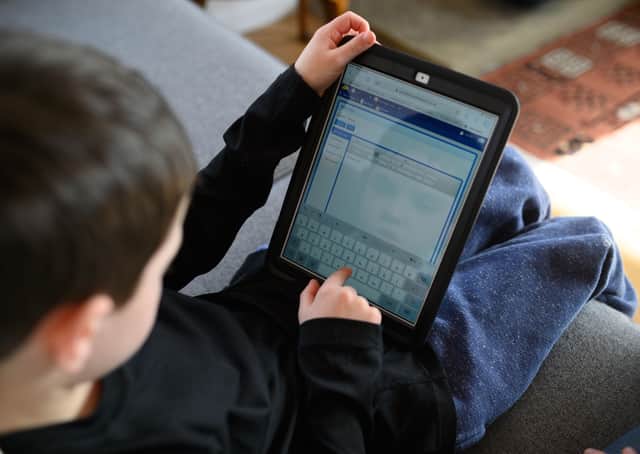 Families across the UK are coming to grips with homeschooling and online resources after the government closed schools to almost all children as a measure to combat the spread of the coronavirus. (Photo by OLI SCARFF / AFP) (Photo by OLI SCARFF/AFP via Getty Images)