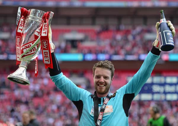 Job done: Adam Collin, of Rotherham United, celebrates Wembley victory. Picture: Getty Images