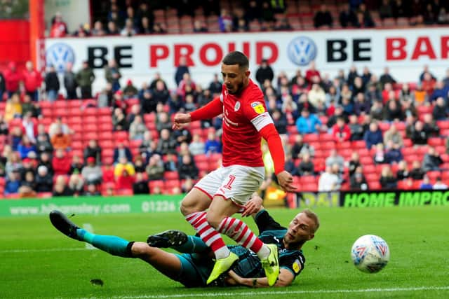 Barnsley v Swansea City. Barnsley player Conor Chaplin is challenged by Mike Van Der Hoorn..19th October 2019.Picture by Simon Hulme
