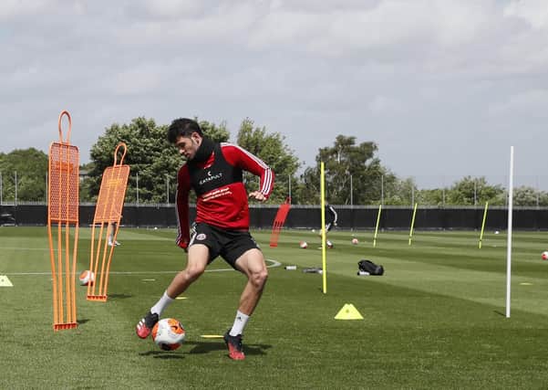 BACK IN THE GAME: Sheffield United's John Egan returns to training as part of the Premier Leagues project restart at the Steelphalt Academy last week. Picture: Simon Bellis/Sportimage
