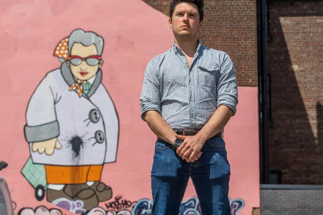 Mike Scrown, Pottery Manager of The Art House, Sheffield, in front of the Pete McKee mural 'Murial', which covers one of building's walls. A limited edition print of Muriel has been donated by McKee for the auction. Picture James Hardisty.