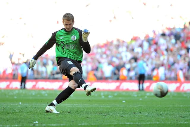 Huddersfield Town's Alex Smithies scores from the penalty spot.