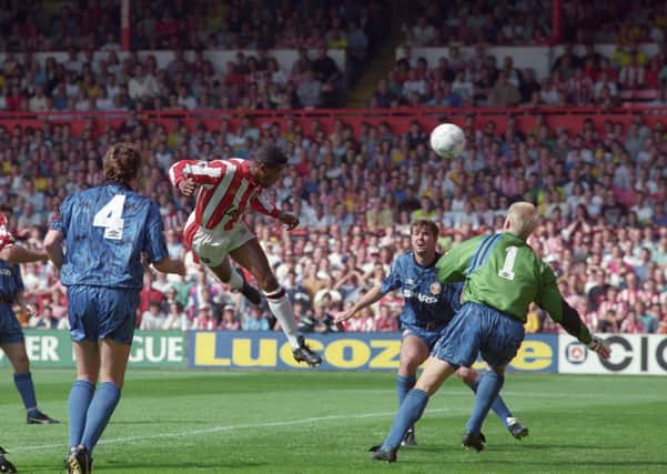 On target: Sheffield United striker Brian Deane scores the first goal in Premiership history, against Manchester United in August, 1992.