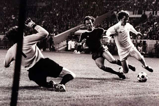 Allan Clarke, left, is scythed down by Franz Beckenbauer. Picture: Varleys.