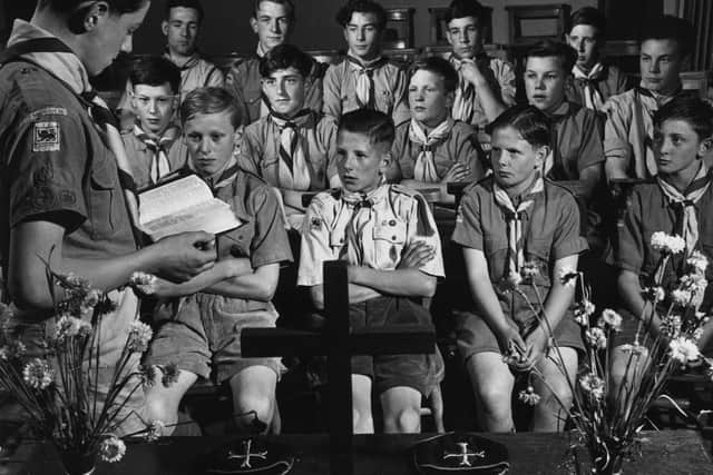 circa 1955:  A scout group in a prayer meeting in Morden, Yorkshire.  (Photo by George Pickow/Three Lions/Getty Images)