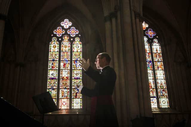 The Revd Michael Smith, York Minster's Canon Pastor, rehearses a digital Evensong service inside the cathedral, as the government moves towards the introduction of measures to bring the country out of lockdown.