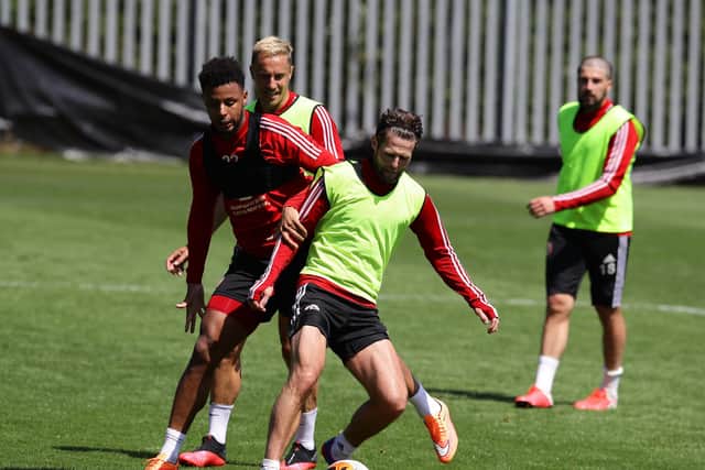Lys Mousset and Oliver Norwood of Sheffield return to contact training as part of the Premier Leagues project restart at the Steelphalt Academy, Sheffield. (Picture: Simon Bellis/Sportimage)