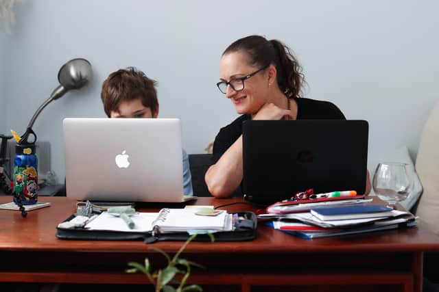 Donna Eddy helps her son Phoenix with school work at their home on April 9, 2020 in Sydney, Australia. PIcture: Getty