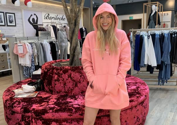 Rebecca Dransfield, daughter of Sandersons founder Deborah Holmes and MD Mark Dransfield, wears pink Tommy Hilfiger jumper dress, £125, at Sandersons boutique department store at Fox Valley near Sheffield.