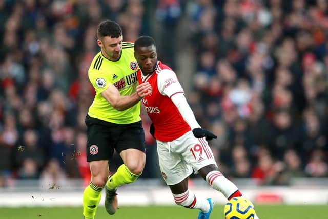 REUNION: Enda Stevens challenges Niclas Pepe when Sheffield United last played Arsenal