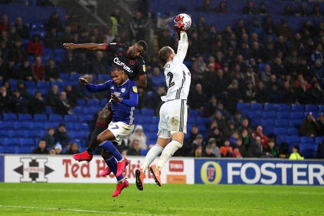 Cardiff City goalkeeper Alex Smithies collects the ball from defender Leandro Bacuna (left) during the Sky Bet Championship match at Cardiff City Stadium. (Picture: David Davies/PA Wire)