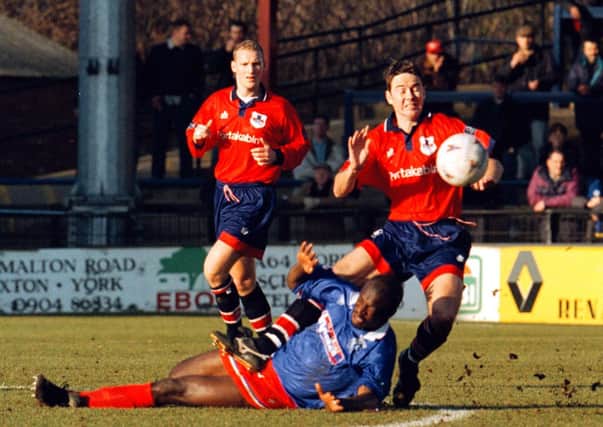 15:02:97: York City -v- Gillingham.
York Cities Andy McMillan gets into a tangle with the Gillingham opposition.
