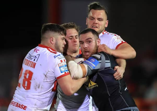 Castleford Tigers' Daniel Smith (right) is tackled down during the Betfred Super League match at Craven Park, Hull. PA Photo. Picture date: Thursday February 27, 2020. See PA story RUGBYL Hull KR. Photo credit should read: Simon Cooper/PA Wire. RESTRICTIONS: Editorial use only. No commercial use. No false commercial association. No video emulation. No manipulation of images