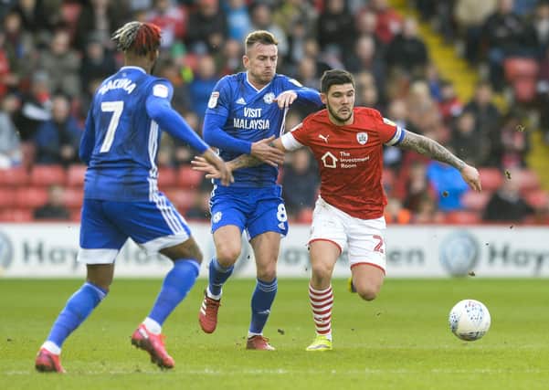 Barnsley's Alex Mowatt comes under pressure from Cardiff's Joe Ralls and Leandro Bacuna at Oakwell on March 7 - the last time Gerhard Struber's team played. Picture: Dean Atkins.