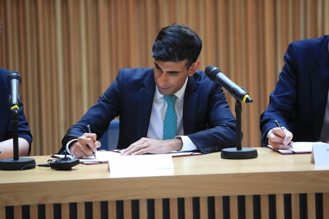 Chancellor Rishi Sunak signing the West Yorkshire Combined Authority devolution deal during a visit to the Nexus Building at the University of Leeds. Picture: Danny Lawson/PA Wire