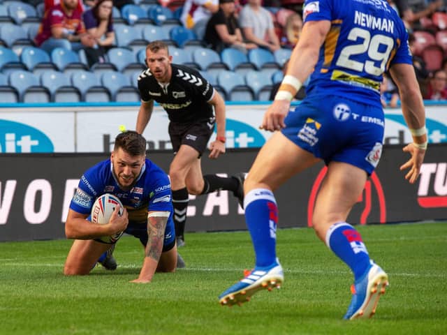 Tom Briscoe scores for Rhinos against Huddersfield last August, seconds before limping off with serious knee damage. Picture by Bruce Rollinson.
