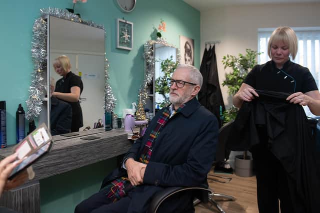 Jeremy Corbyn getting a haircut on the campaign trail last year - PA pic