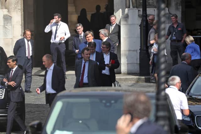 Chancellor Rishi Sunak (left) during Tuesday's chaotic votes at Parliament.