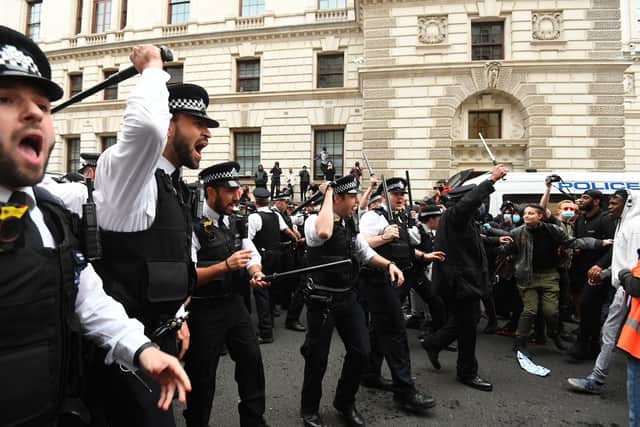 Police and protesters at a Black Lives Matter rally on Whitehall.