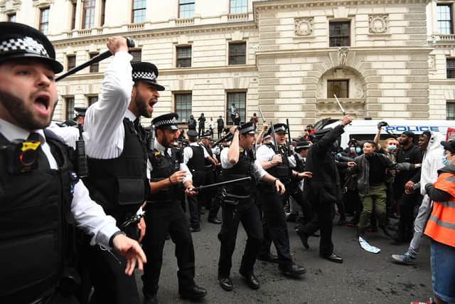 Protestors and police officers during a Black Lives Matter protest rally on Whitehall, London, in memory of George Floyd who was killed on May 25.