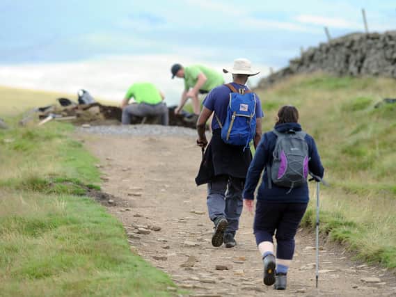 Walkers use the footpaths on Whernside in the Yorkshire Dales