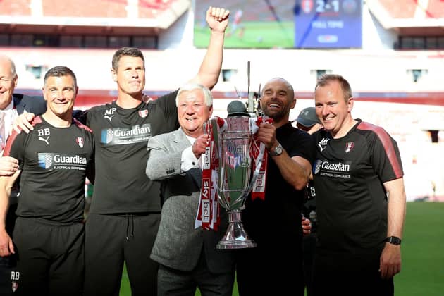 GOING UP: Rotherham United chairman Tony Stewart, seen with manager Paul Warne and his coaching team celebrating the club's last promotion to the second tier two years ago via a Wembley play-off final. Picture: Nigel French/PA