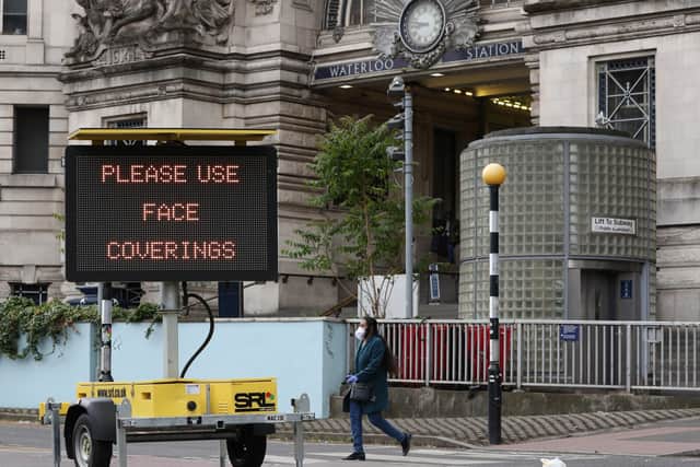 A wartning sign outside Waterloo Station after Transport Secretary Grant Shapps confirmed that  face coverings on public transport will be mandatory from June 15.